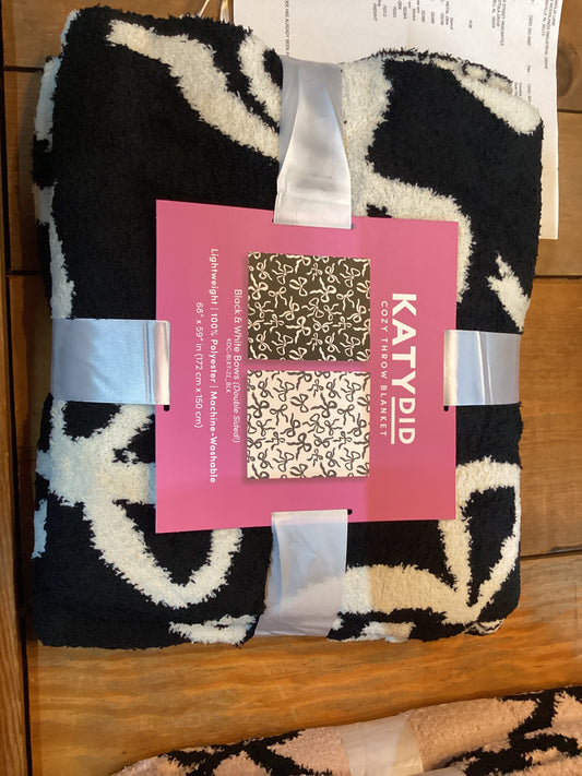 Double sided bow blanket